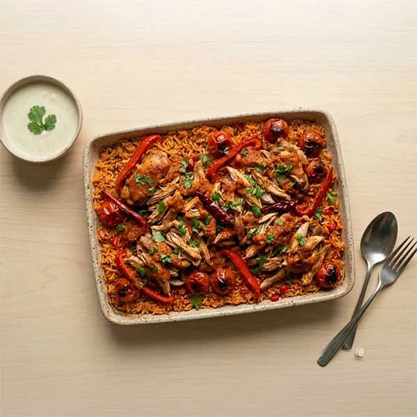 Gulf daqoos baked chicken with tomato-chili rice